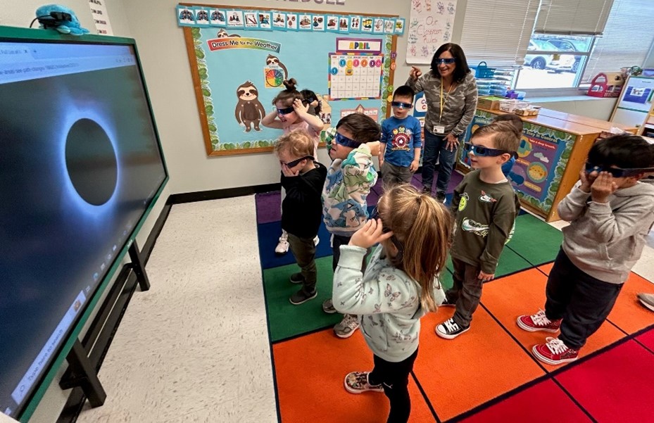 BCCS students viewig the ecplise om the TV