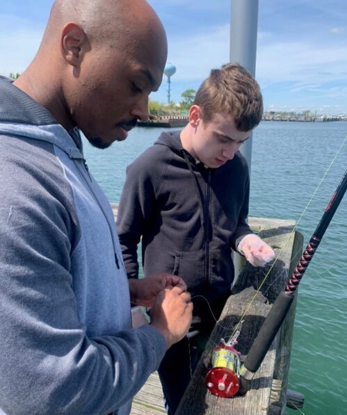 Noah and Adrian from House 28 of the Children’s Residential Program fishing at Lido Beach