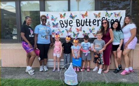 BCCS staff and students pose for a photo before the butterfly release