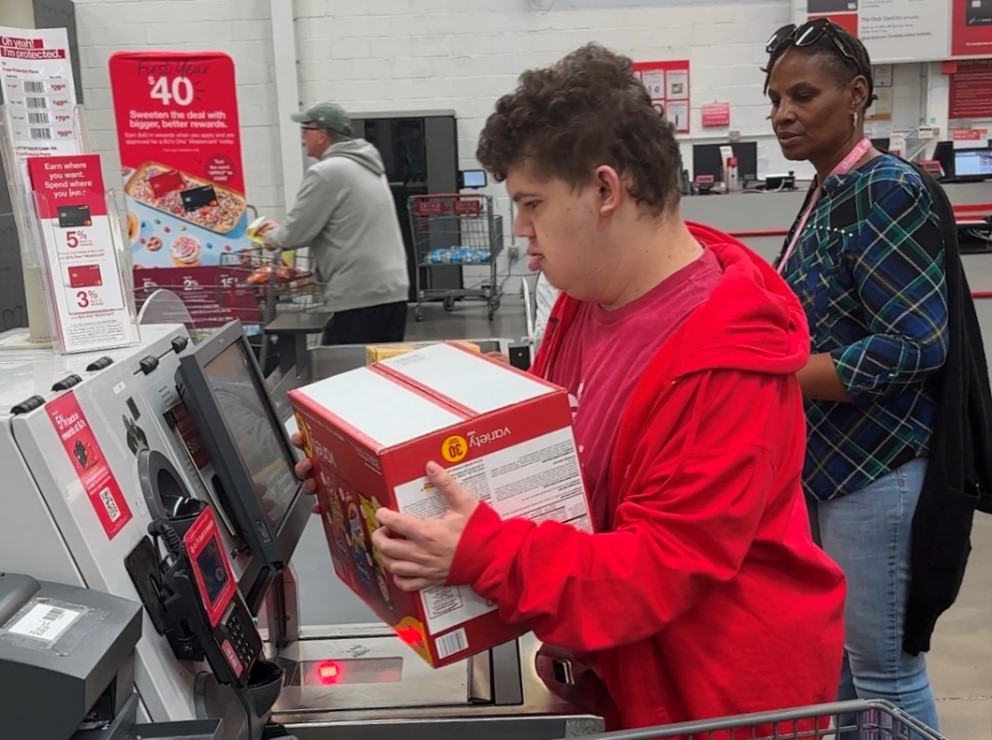A student at our Children’s Education Center learning lifelong skills while shopping at the store.