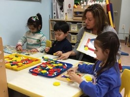 Special Education teacher Jamie Schantz working with students in her classroom
