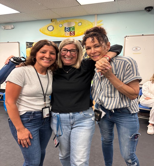 Marcus Avenue Preschool Teacher Sharon Levenson and her coworkers at her retirement party.