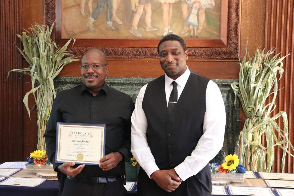 Ronny Fisher is presented with the Employee of the Quarter award.