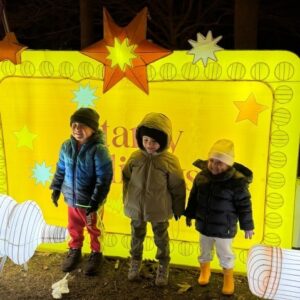 Barbara C. Wilson students in front of a holiday light display.