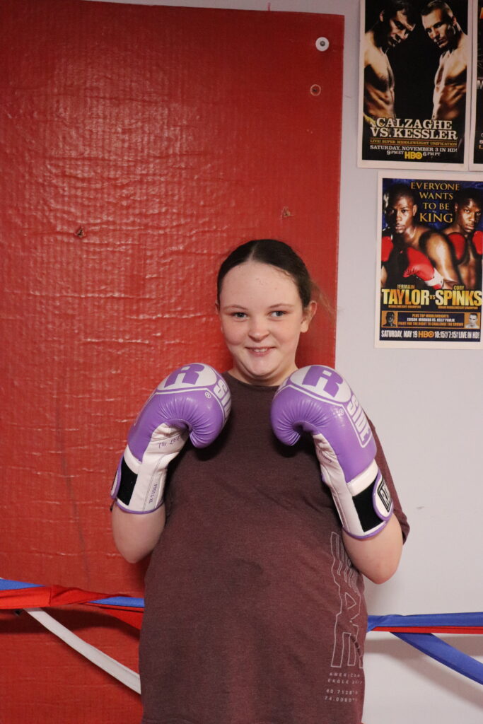 Faith with her purple boxing gloves.
