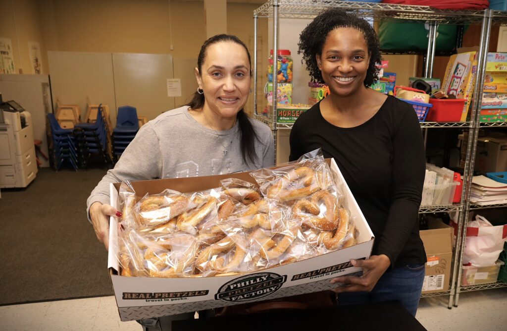 Round Hill Road PA members carry pretzels for the pretzel sale.