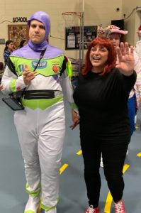 Student dressed as an astronaut arrives with teacher