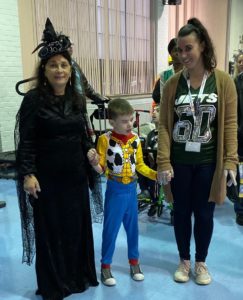 Two teachers arrive with student dressed as a cowboy