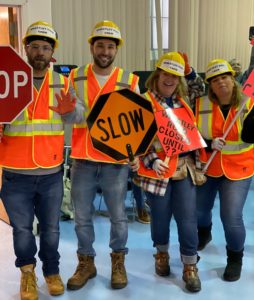 Teachers from the Silver School pose in construction costumes for Halloween party