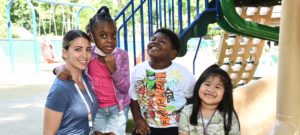 teacher and children on playground
