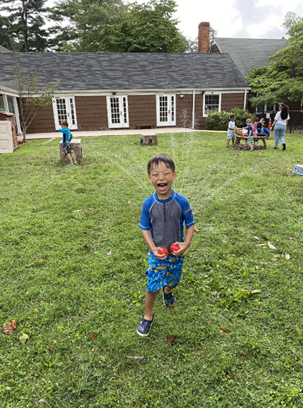A student enjoys water play this summer
