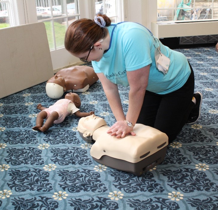 A BCCS staff member practices CPR during Staff Development Day
