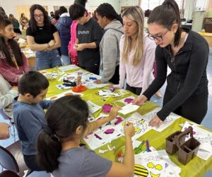 Lynbrook High School students do arts and crafts with BCCS students