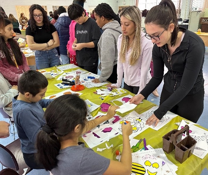 Lynbrook High School students do arts and crafts with BCCS students