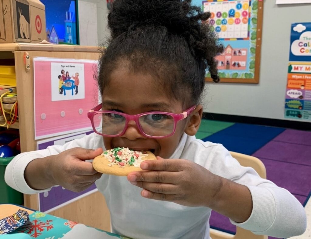 BCCS student eating a holiday cookie