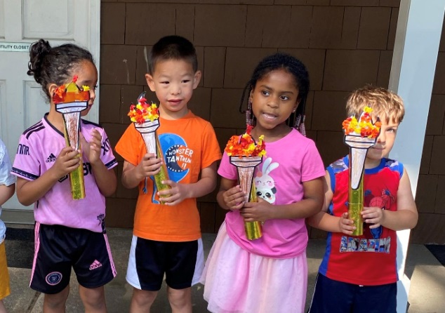 BCCS students with the Olympics torch crafts they created.