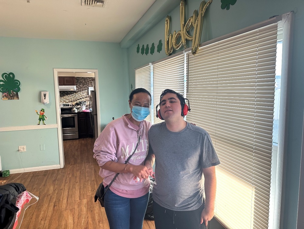 A resident and a staff member at the Children's Residential Center.