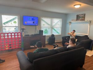 Residents of the Children's Residential Center watching TV together.