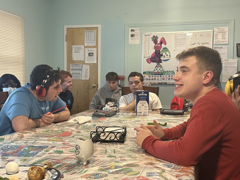 Residents of the Children's Residential Program at the table before Seder.