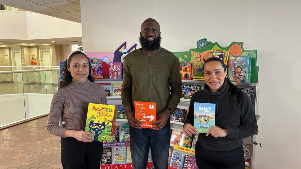 Rickey Rogers and two other Parents' Association members  at the book fair.