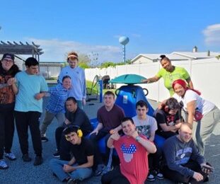 Kristine Jones at the beach with CRP residents and staff members.