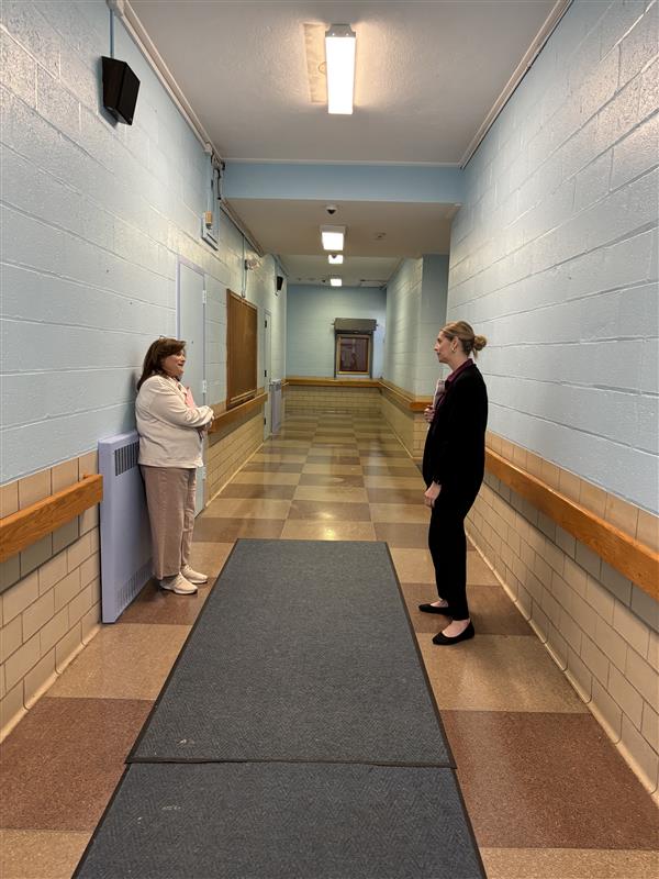 Two Marcus Avenue teachers in the hallway of their new school.