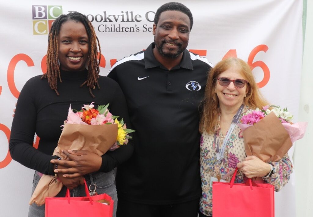 CRP staff members pose with flowers.