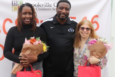 CRP staff members pose with flowers.