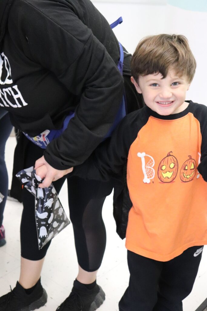 A BCCS student wears a Halloween shirt that reads "BOO!"